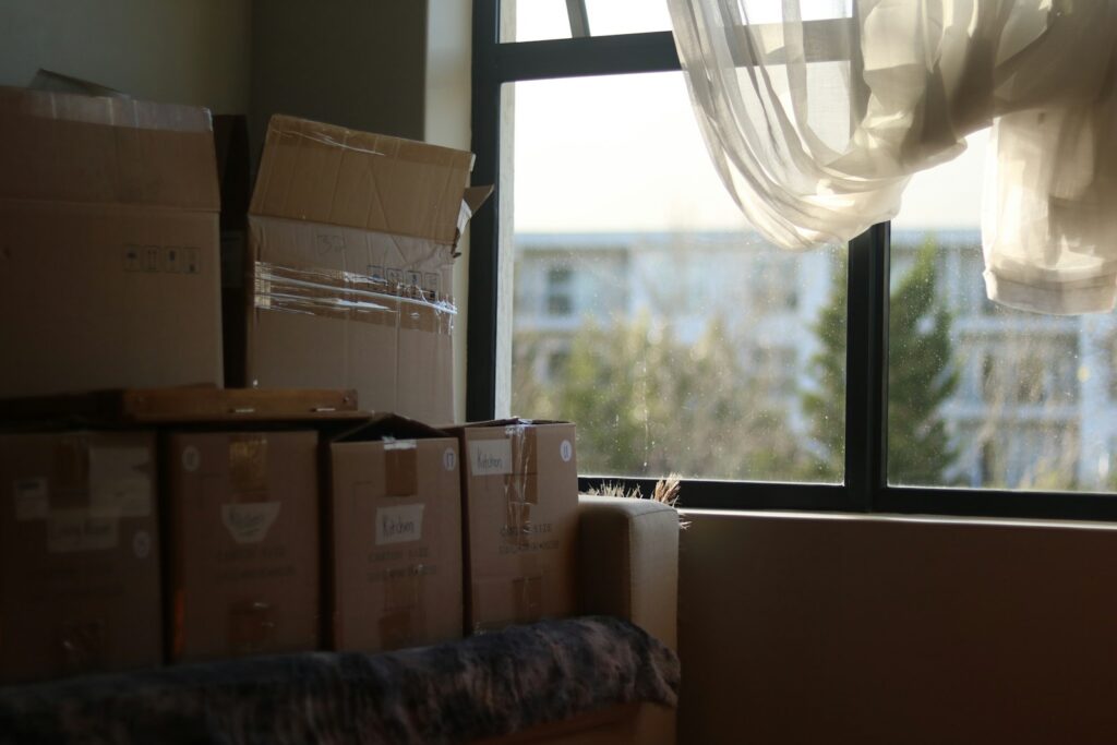 Moving boxes packed in a room