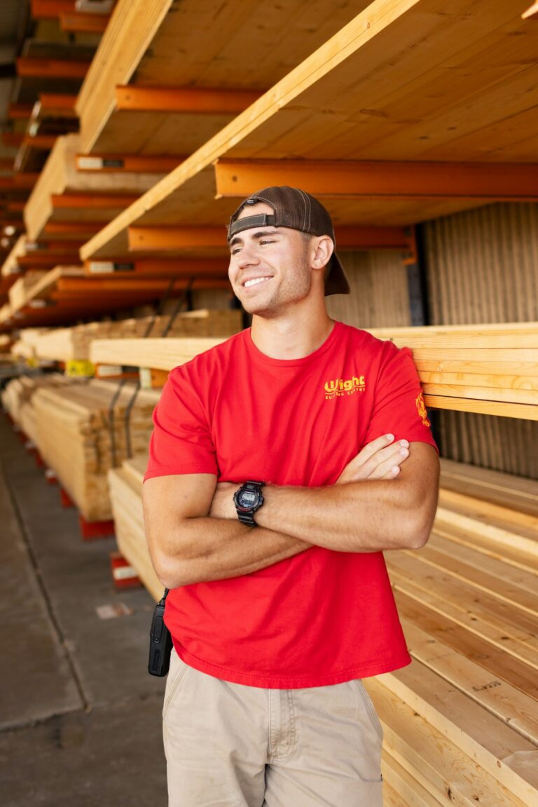 Smiling tradesman at a lumberyard